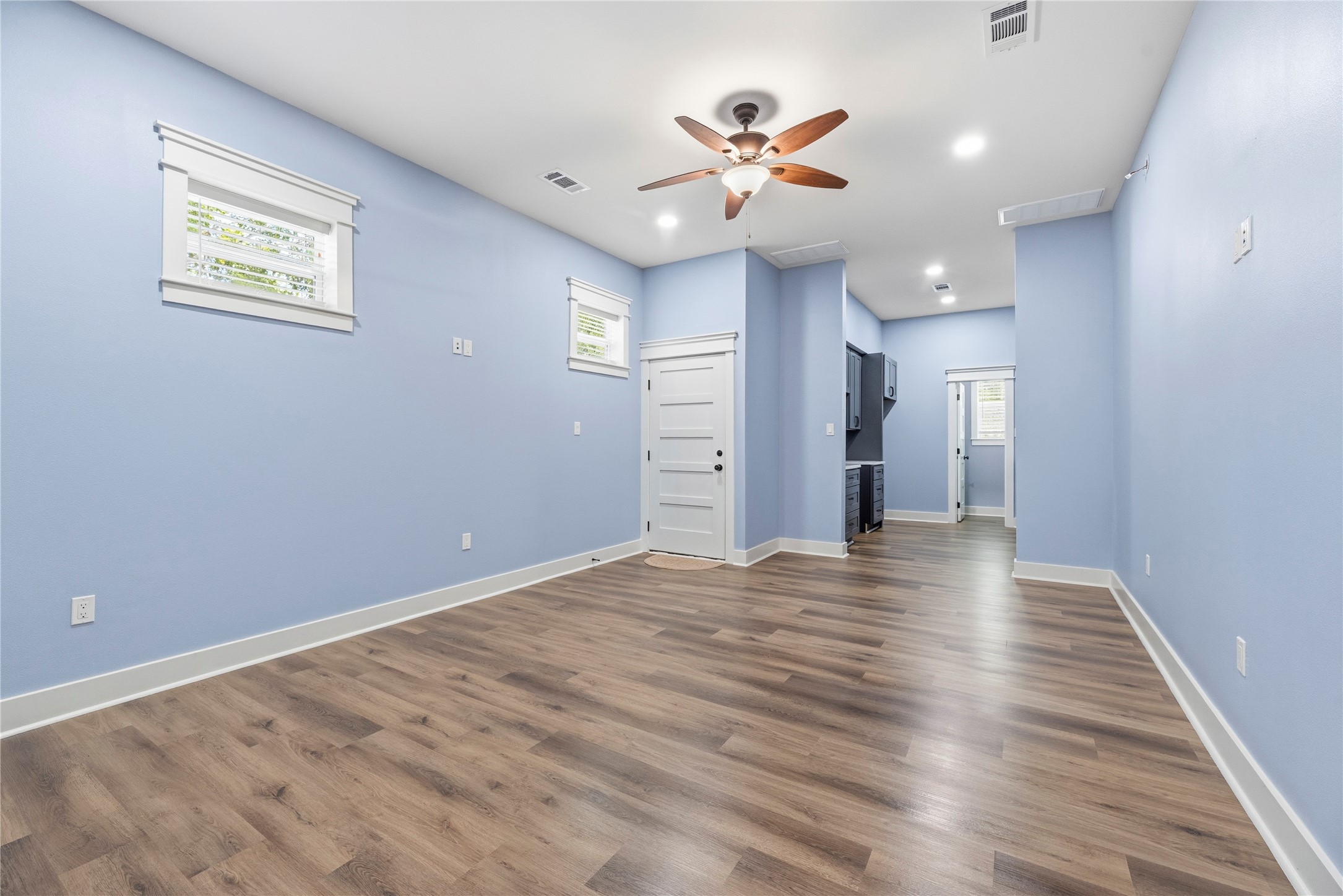 4607 Clayhead Road Richmond, TX 77406 - Photo 31 of 49 Spacious living room within the private living quarters featuring soaring ceilings, private entry access, and an open-concept layout designed for comfort.