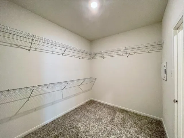 a view of a room with racks on the wall