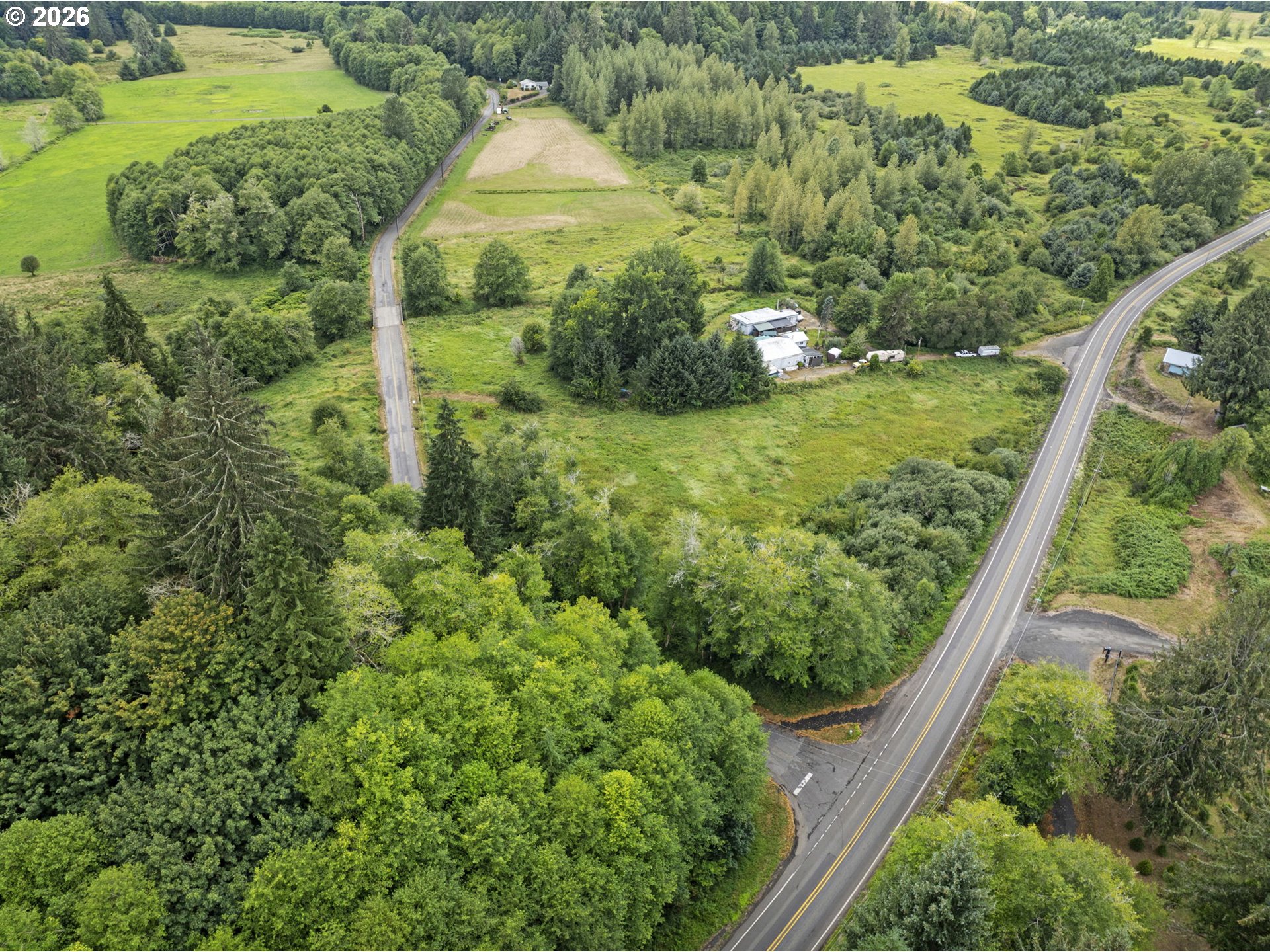 4 West State Route Skamokawa, WA 98647 - Photo 8 of 8 a view of a green yard with large trees