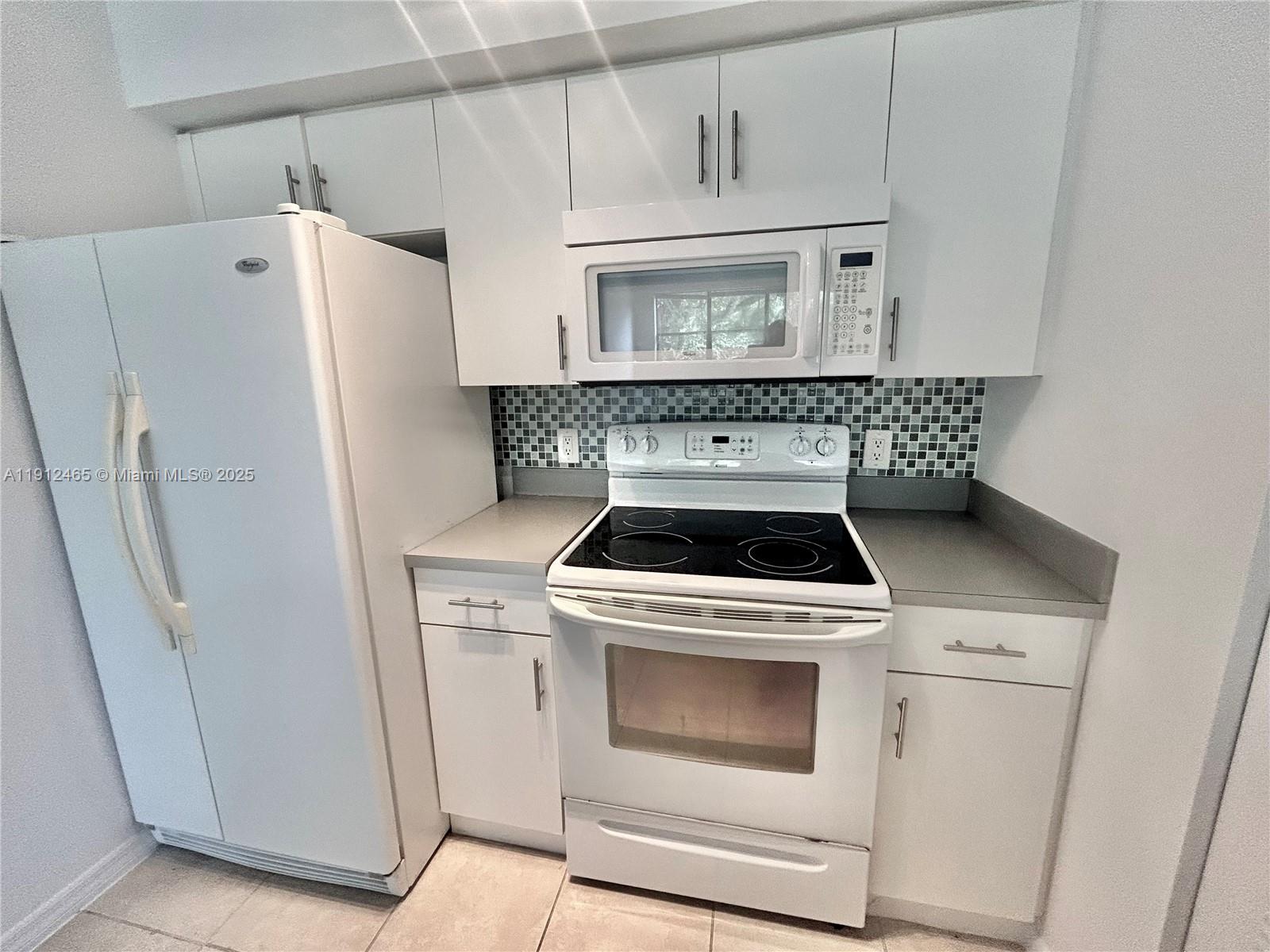 540 South Park Road, Unit 229 Hollywood, FL 33021 - Photo 1 of 44 a white stove top oven sitting inside of a kitchen
