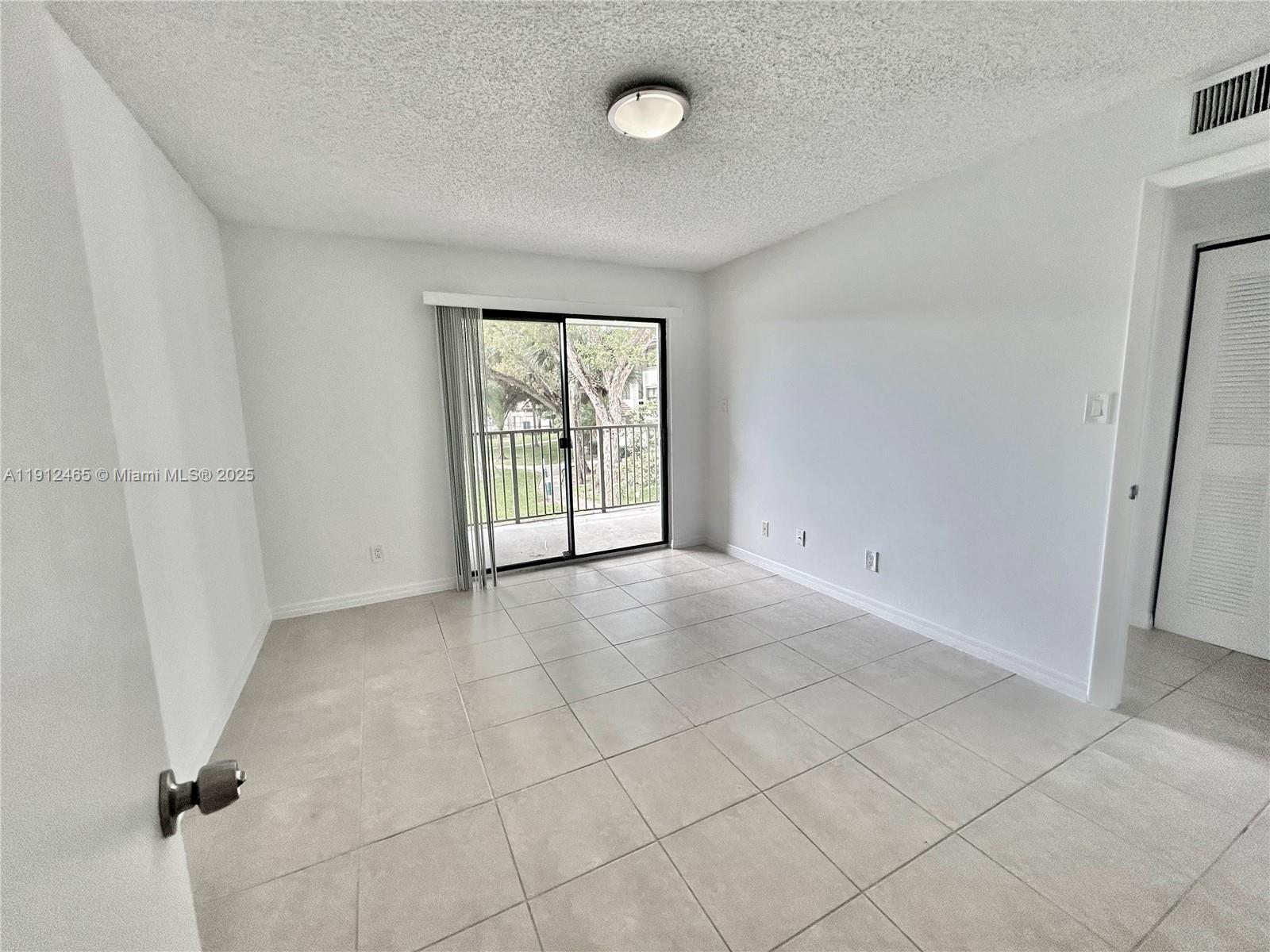 540 South Park Road, Unit 229 Hollywood, FL 33021 - Photo 19 of 44 an empty room with windows