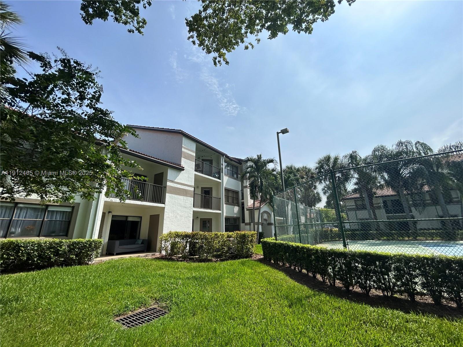 540 South Park Road, Unit 229 Hollywood, FL 33021 - Photo 29 of 44 a front view of a house with a garden