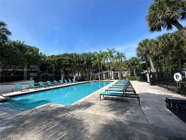 a view of a swimming pool with a lounge chair
