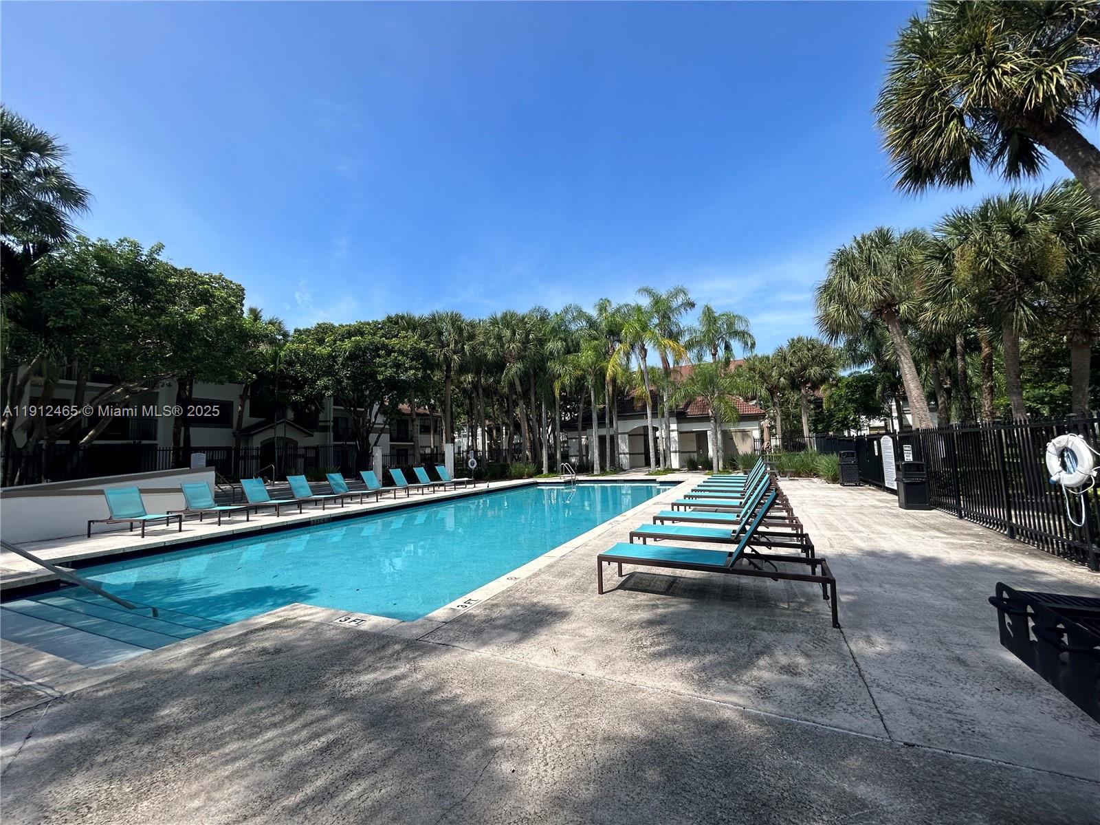 540 South Park Road, Unit 229 Hollywood, FL 33021 - Photo 33 of 44 a view of a swimming pool with a lounge chair