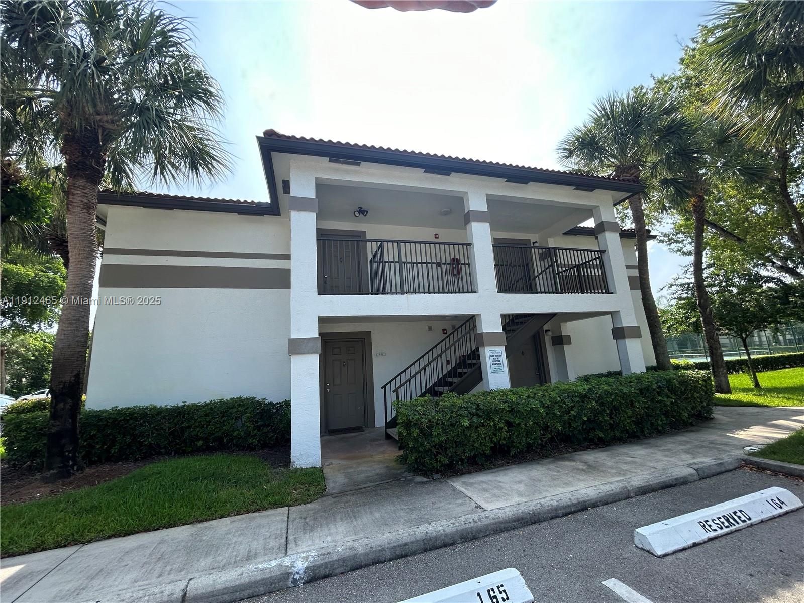 540 South Park Road, Unit 229 Hollywood, FL 33021 - Photo 36 of 44 a front view of a house with a garden