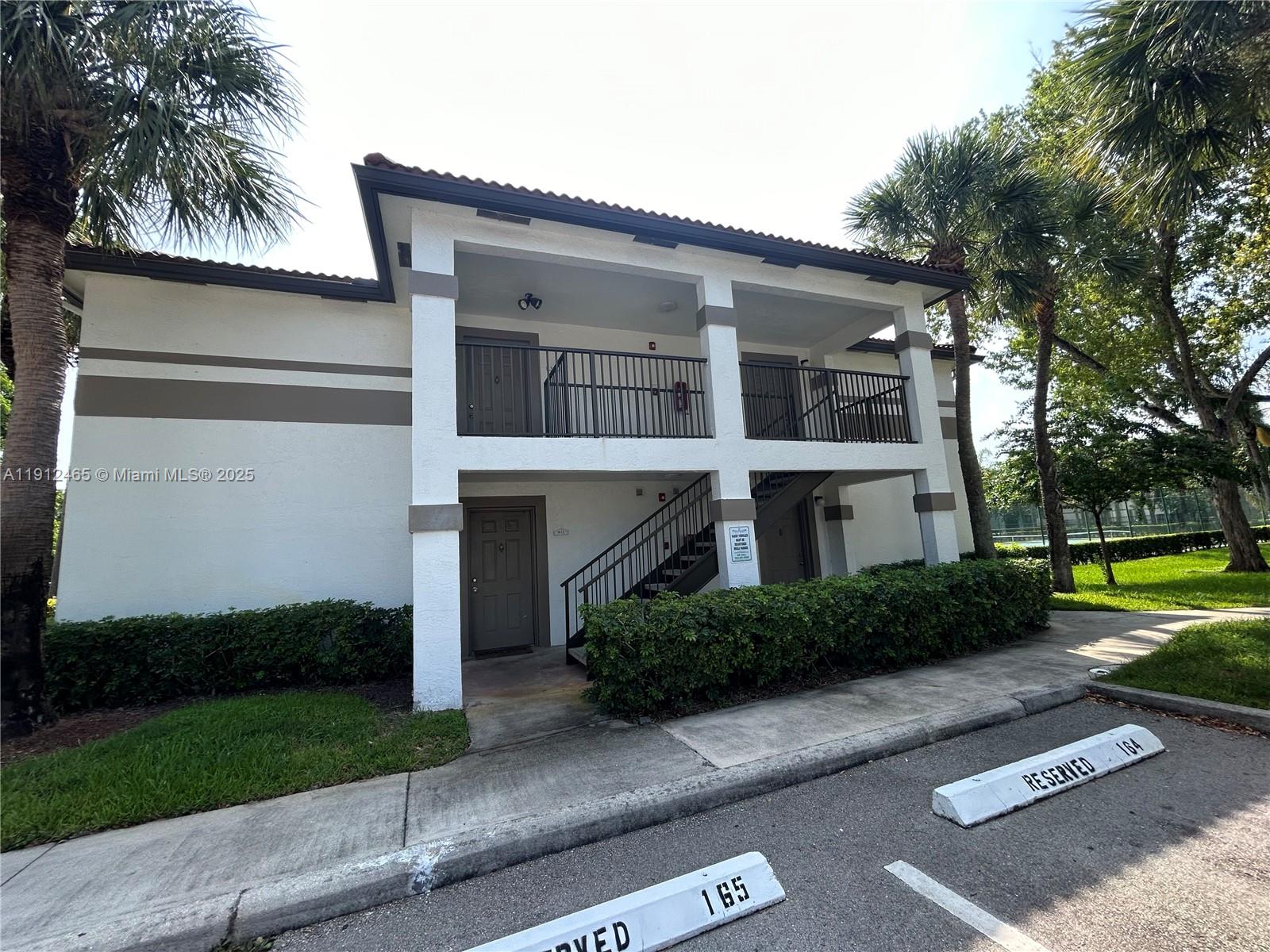 540 South Park Road, Unit 229 Hollywood, FL 33021 - Photo 37 of 44 a front view of a house with a yard