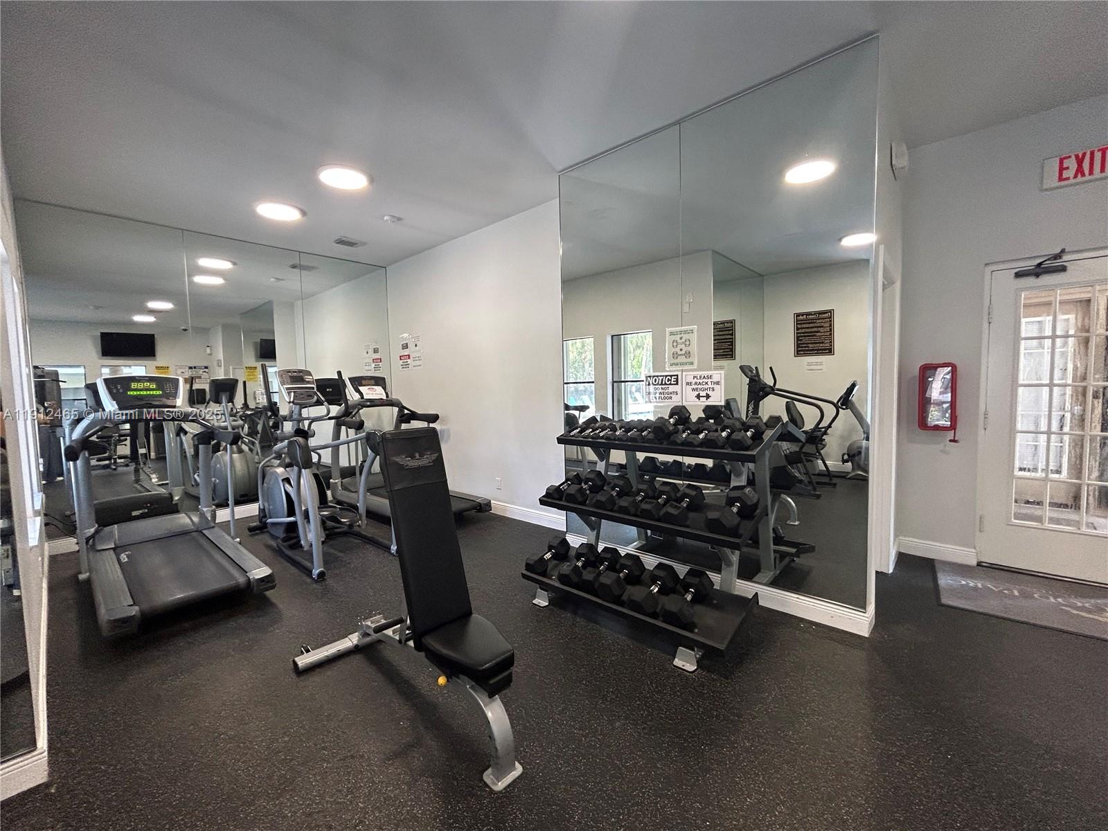 540 South Park Road, Unit 229 Hollywood, FL 33021 - Photo 43 of 44 a room with gym equipment and wooden floor