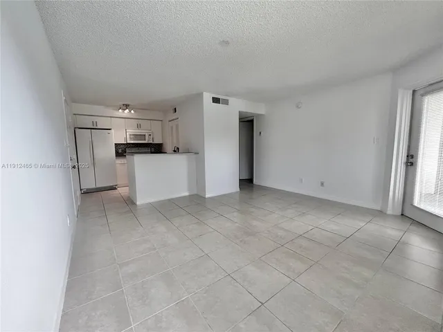 a view of a storage & utility room with cabinets