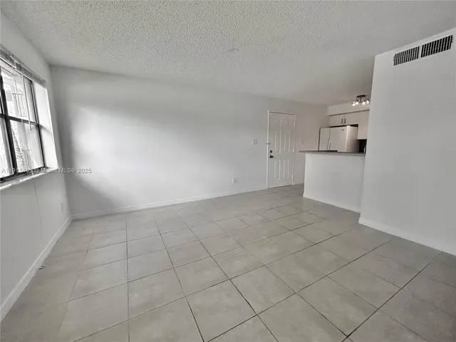 a view of a kitchen with a sink