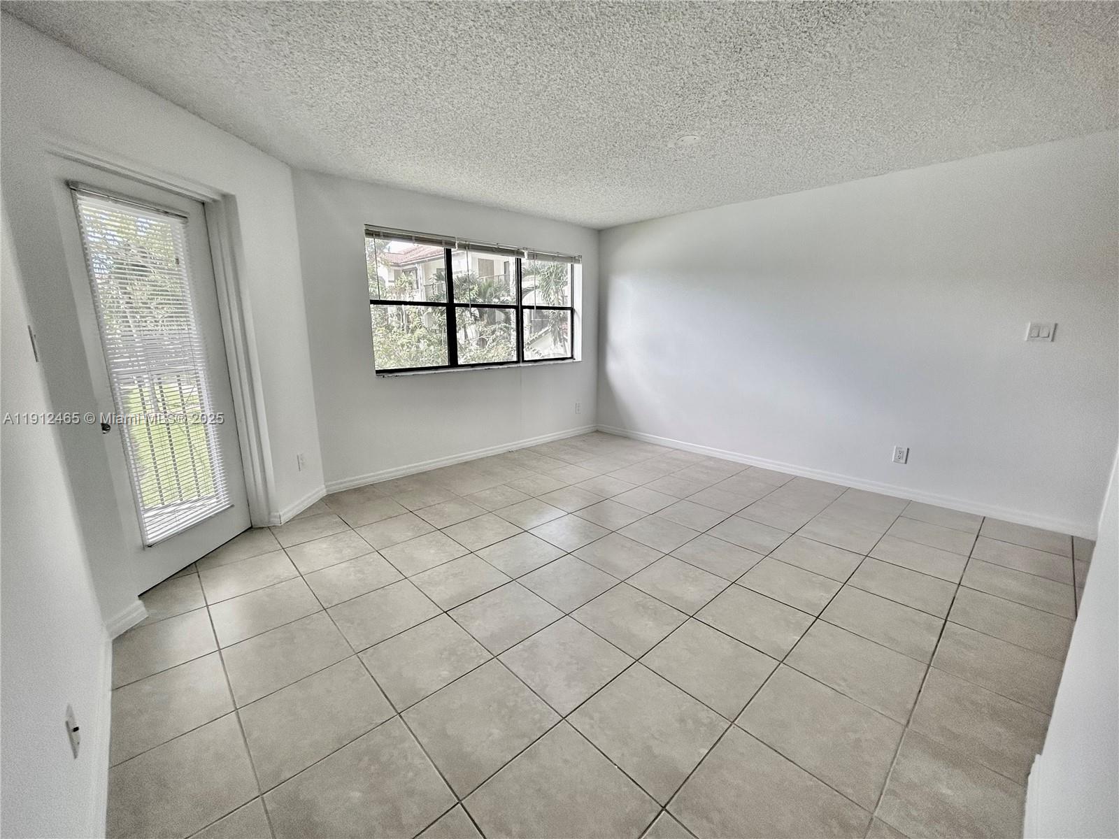 540 South Park Road, Unit 229 Hollywood, FL 33021 - Photo 10 of 44 an empty room with windows