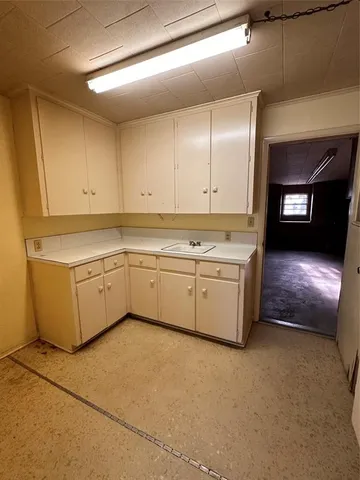 a view of empty room with a fireplace