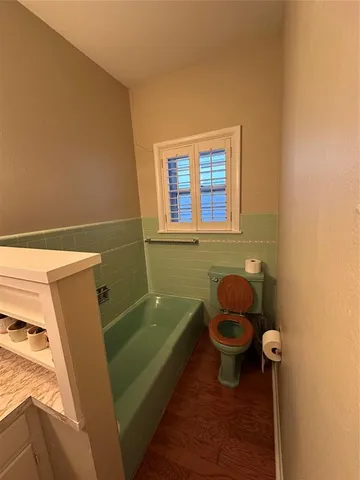 a kitchen with granite countertop a stove and a sink
