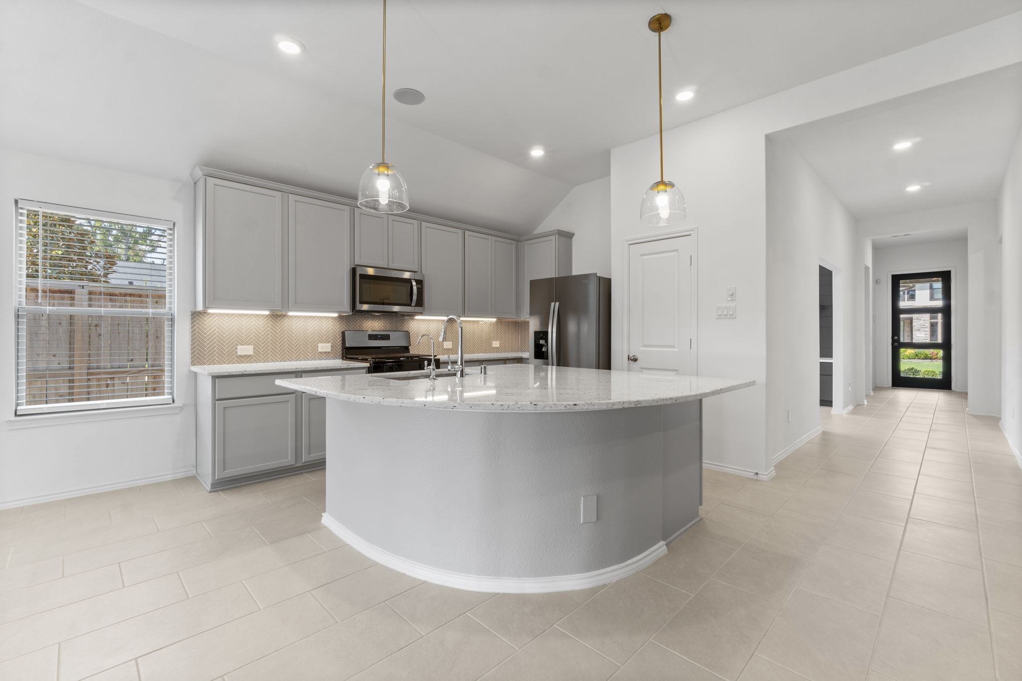 21719 Grayson Highlands Way Porter, TX 77365 - Photo 16 of 42 The kitchen, dining area and living area are all openm , great ceiling height
