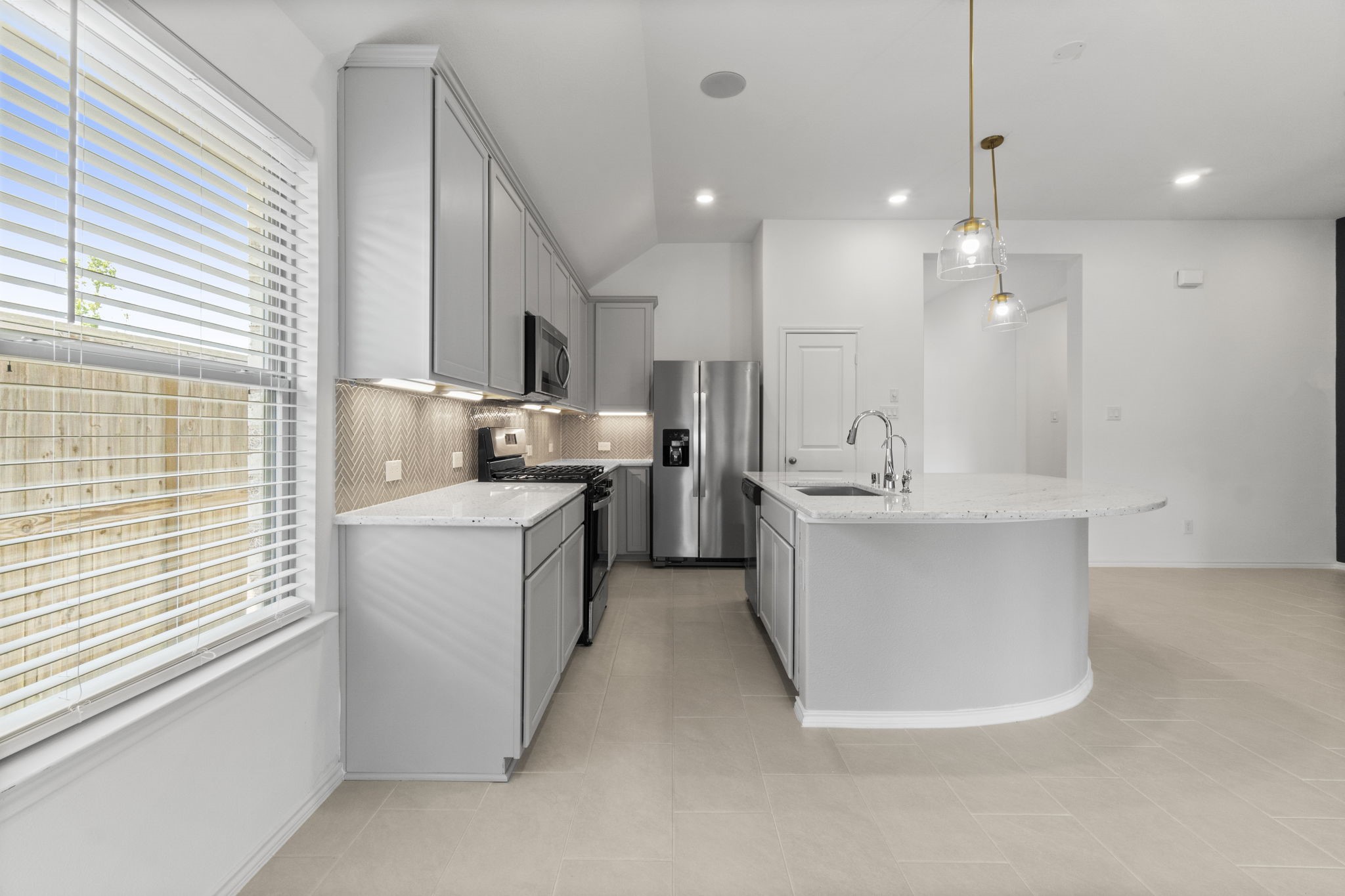 21719 Grayson Highlands Way Porter, TX 77365 - Photo 17 of 42 The kitchen is in the center of the action.