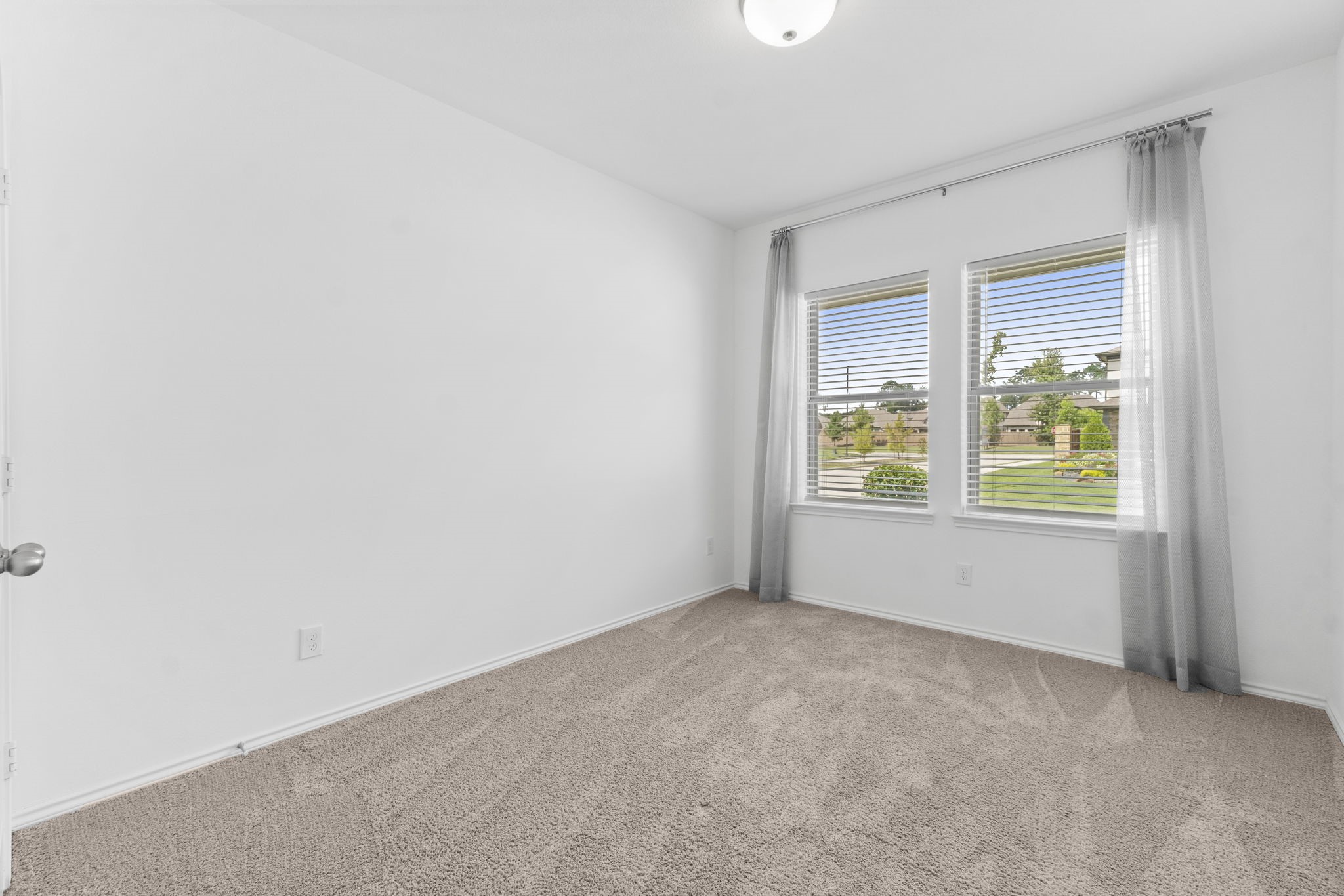 21719 Grayson Highlands Way Porter, TX 77365 - Photo 33 of 42 This is the 2nd. secondary bedroom that is located in the fron of the house