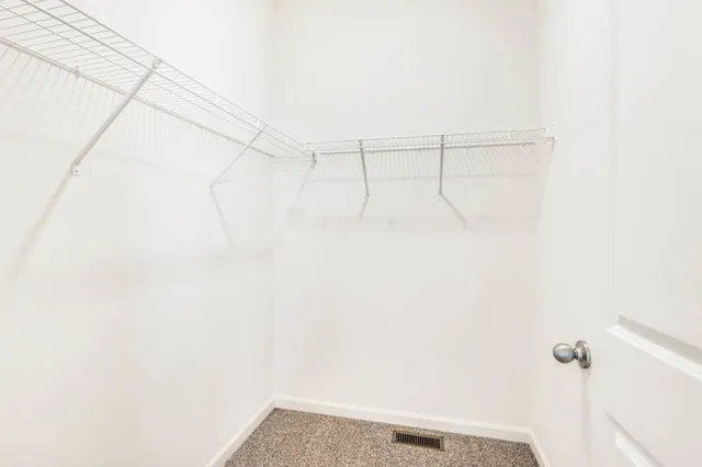 a bathroom with a double vanity sink a mirror and a shower