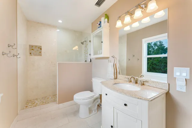 a bedroom with a bed and a dresser in it