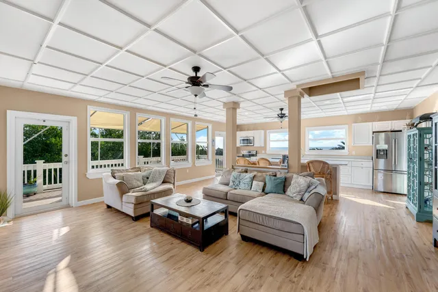 a living room with furniture and flat screen tv