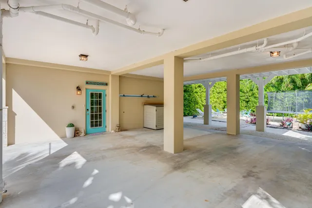a view of a porch with wooden floor and front door