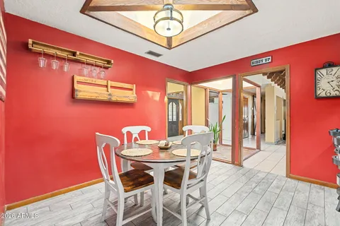 a dining room with furniture and window