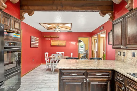 a kitchen with stainless steel appliances granite countertop a stove and a sink