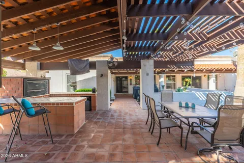 a view of a chairs and table in a patio