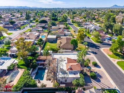 an aerial view of residential houses with outdoor space