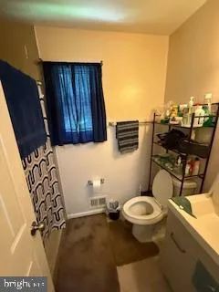 a bed sitting in a bedroom next to a wall