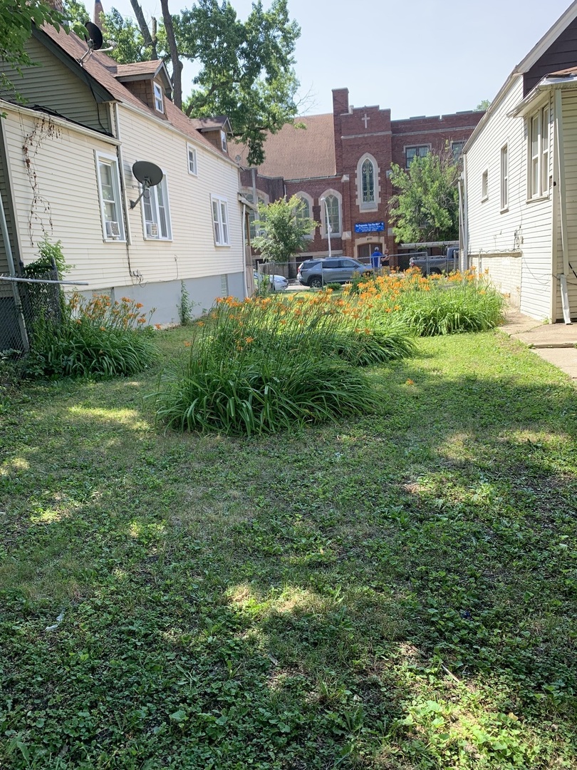 5040 West Ohio Street Chicago, IL 60644 - Photo 2 of 2 a view of a house with a yard