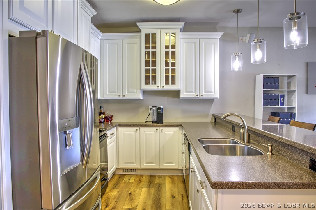 275 Flynn Road, Unit 106 Lake Ozark, MO 65049 - Photo 6 of 39 Custom cabinets with solid surface tops