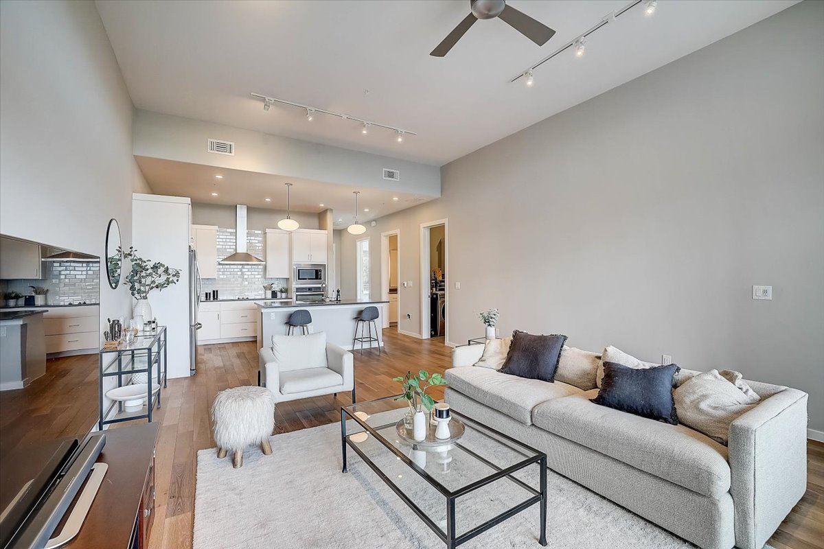 5921 Hiline Road, Unit 1204 Austin, TX 78734 - Photo 7 of 36 Living area featuring light wood-style floors and ceiling fan