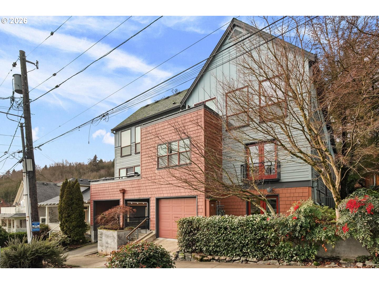 5047 Southwest View Point Terrace, Unit C Portland, OR 97239 - Photo 2 of 38 a view of a house with a yard