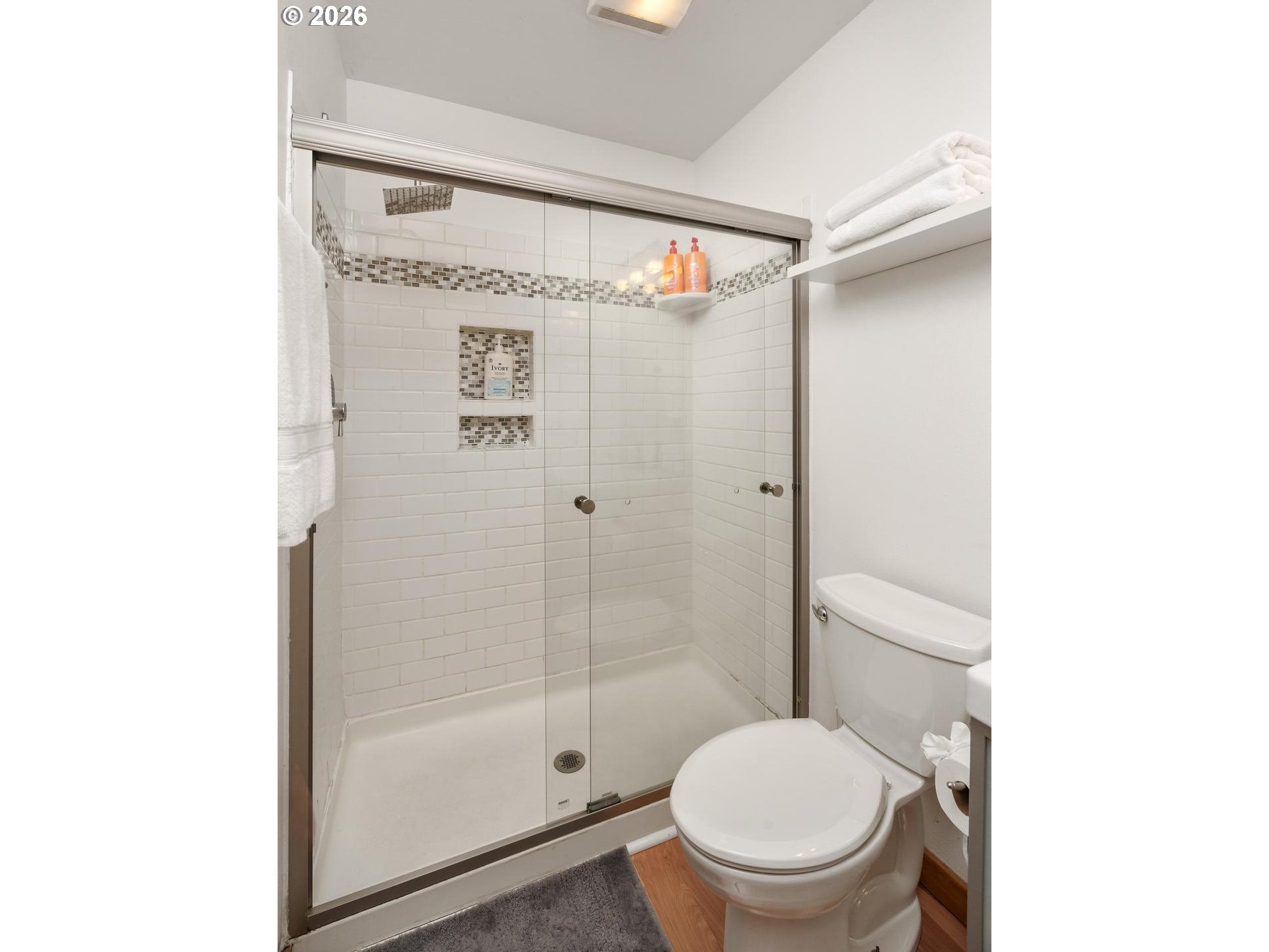 5047 Southwest View Point Terrace, Unit C Portland, OR 97239 - Photo 24 of 38 a bathroom with a shower and a toilet