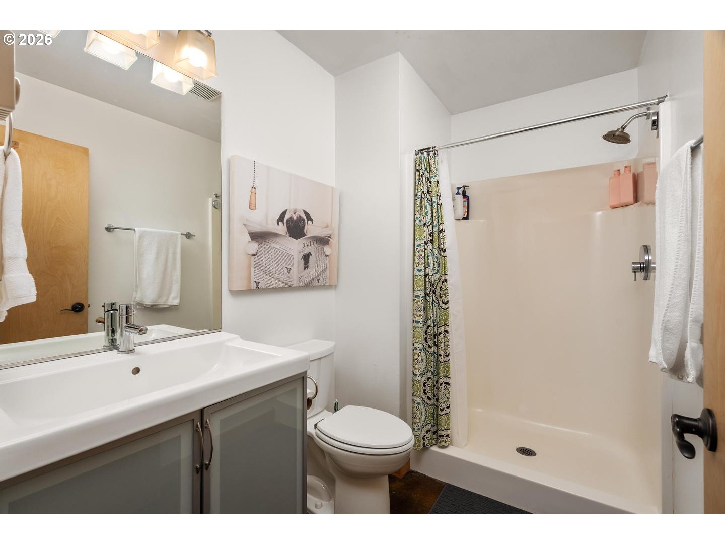 5047 Southwest View Point Terrace, Unit C Portland, OR 97239 - Photo 32 of 38 a bathroom with a sink toilet and shower
