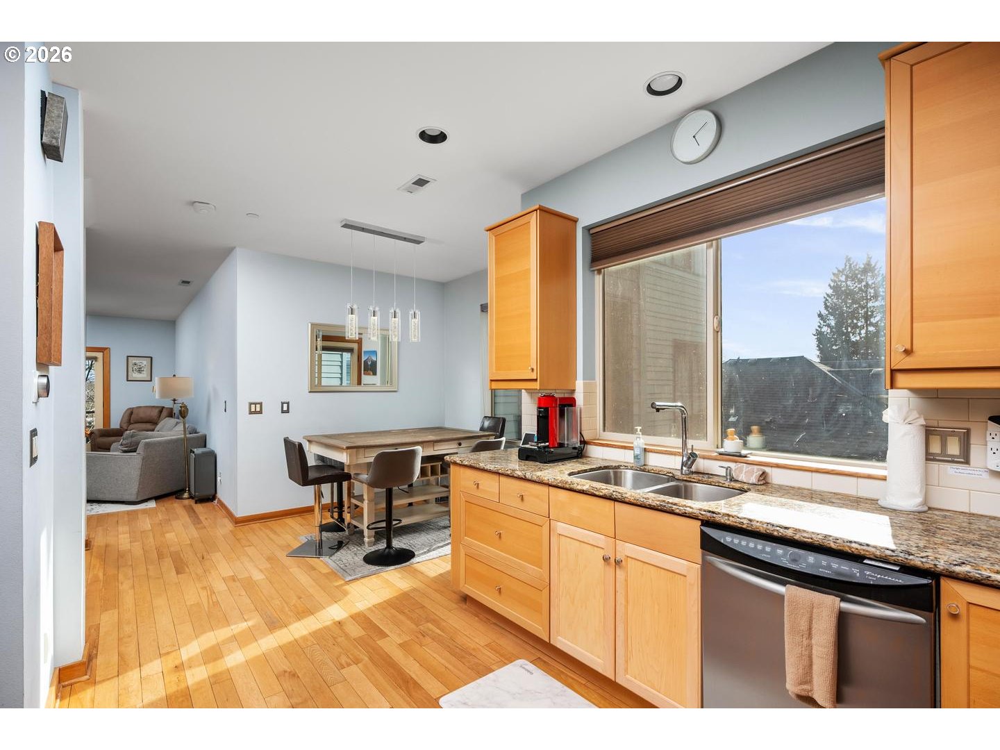 5047 Southwest View Point Terrace, Unit C Portland, OR 97239 - Photo 9 of 38 a kitchen with a sink cabinets and dining table