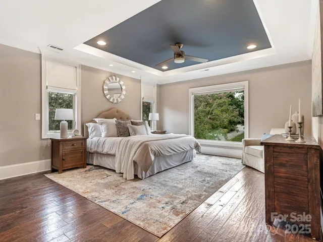 a bedroom with a large bed and a large window