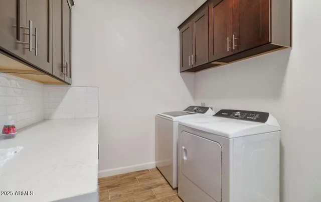 a bathroom with a double vanity sink and mirror