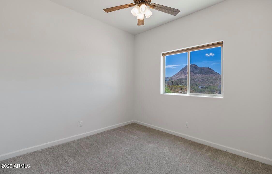 48126 North Coyote Pass Road New River, AZ 85087 - Photo 18 of 23 an empty room with a window