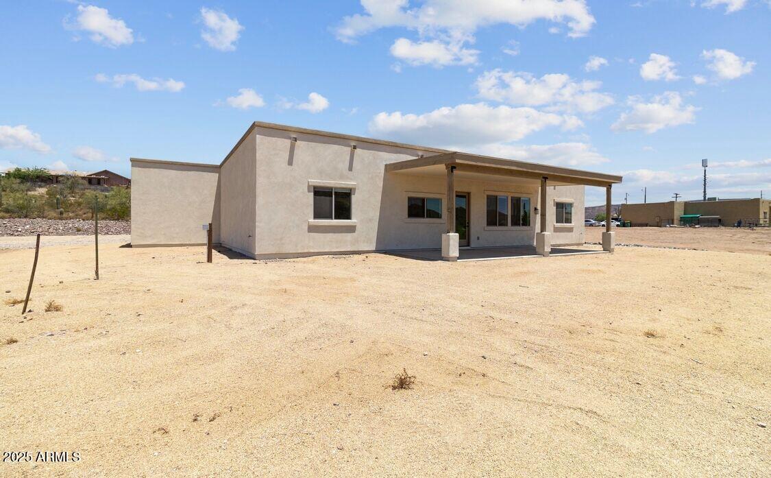 48126 North Coyote Pass Road New River, AZ 85087 - Photo 22 of 23 a view of a house with snow on the road