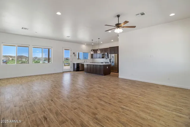 a view of a kitchen with a sink and a window