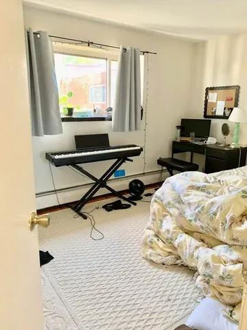 a room with gym equipment and a window