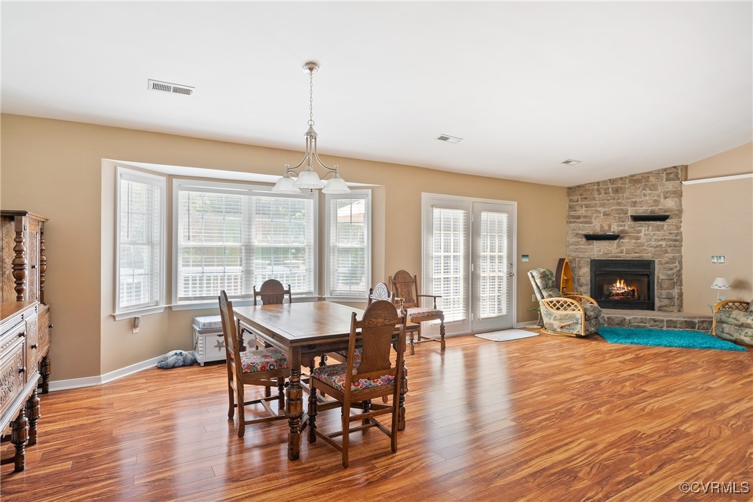 5026 Water View Road Water View, VA 23180 - Photo 16 of 50 Dining area featuring baseboards, a fireplace, woo