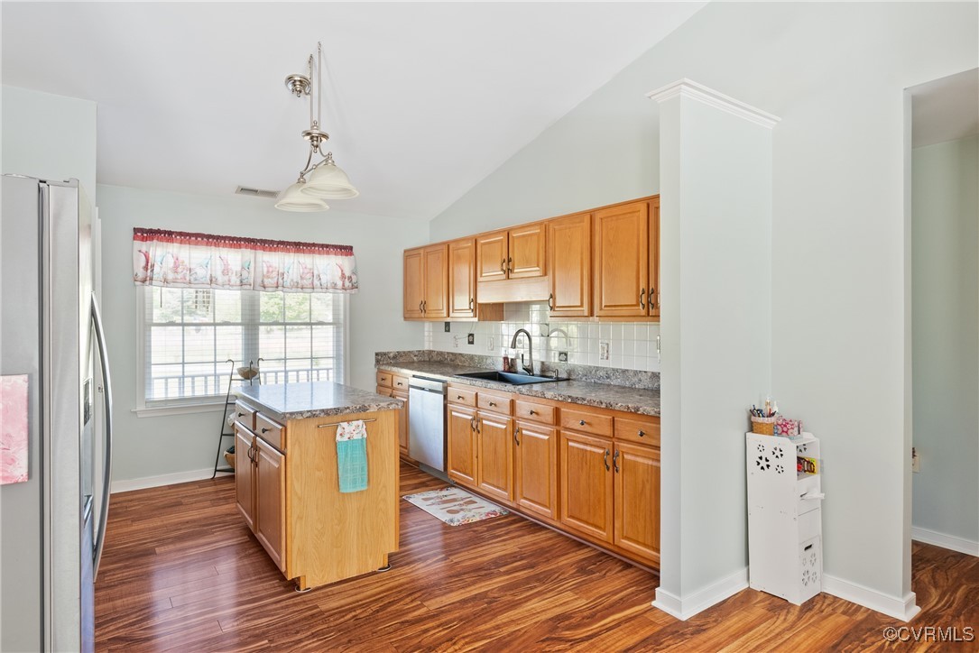 5026 Water View Road Water View, VA 23180 - Photo 17 of 50 Kitchen with a kitchen island, a sink, dark wood f