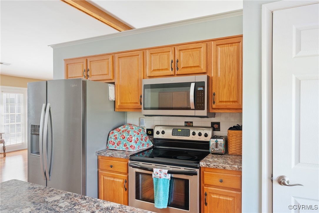 5026 Water View Road Water View, VA 23180 - Photo 19 of 50 Kitchen with crown molding, light stone countertop