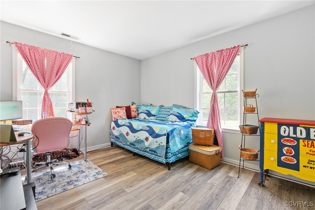 5026 Water View Road Water View, VA 23180 - Photo 33 of 50 Bedroom with baseboards, visible vents, and wood f