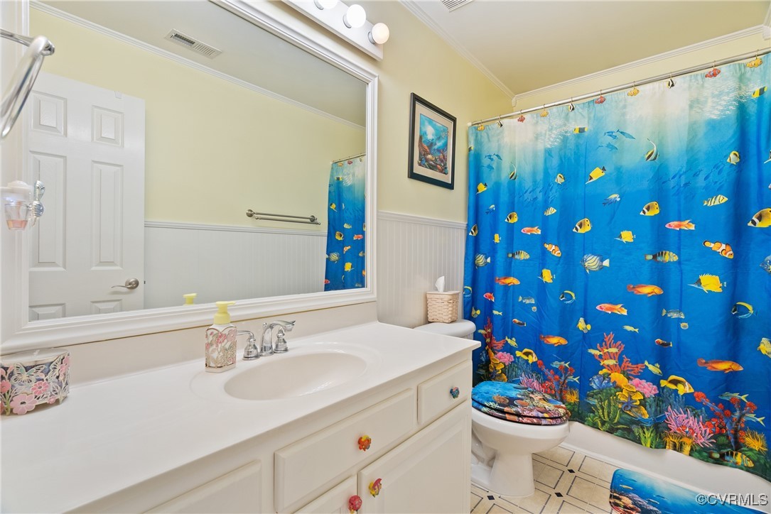 5026 Water View Road Water View, VA 23180 - Photo 34 of 50 Bathroom with crown molding, vanity, toilet, a wai