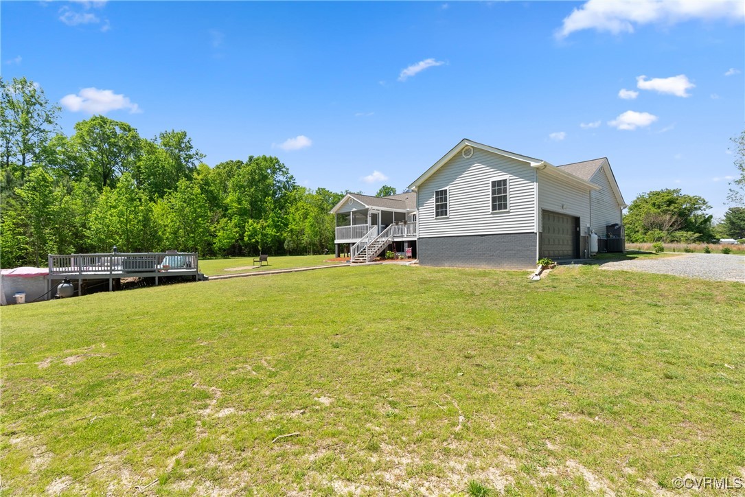 5026 Water View Road Water View, VA 23180 - Photo 46 of 50 View of yard with a sunroom, driveway, a deck, and