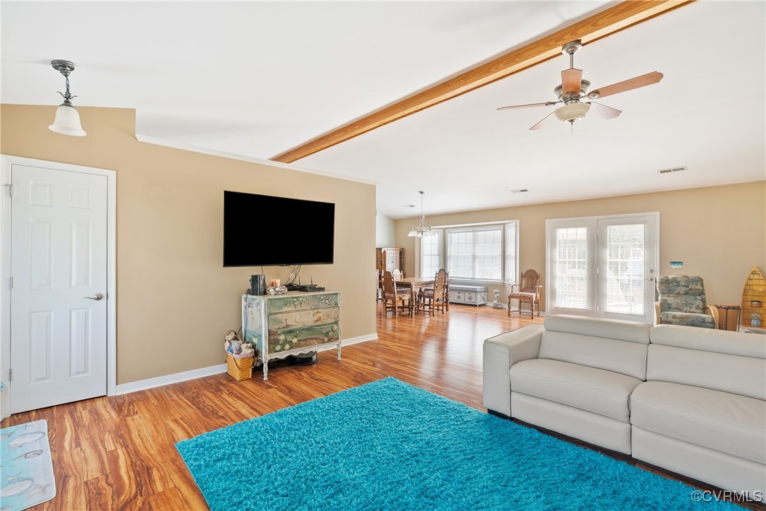 5026 Water View Road Water View, VA 23180 - Photo 10 of 50 Living area with ceiling fan, visible vents, wood
