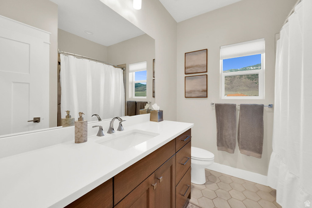 352 East Boulderville Road Oakley, UT 84055 - Photo 25 of 62 Bathroom with a shower with shower curtain, vanity, and light tile patterned floors