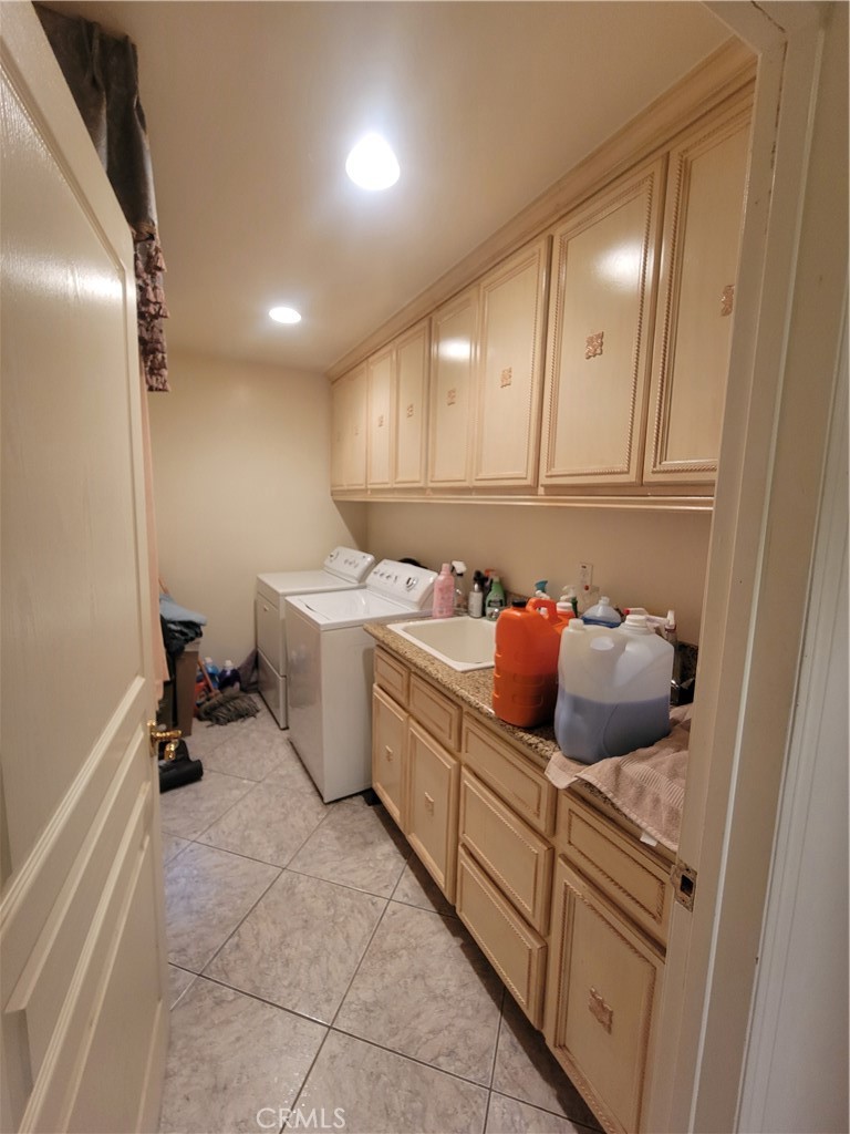 8009 Rose Street Paramount, CA 90723 - Photo 13 of 18 a kitchen with a sink and cabinets